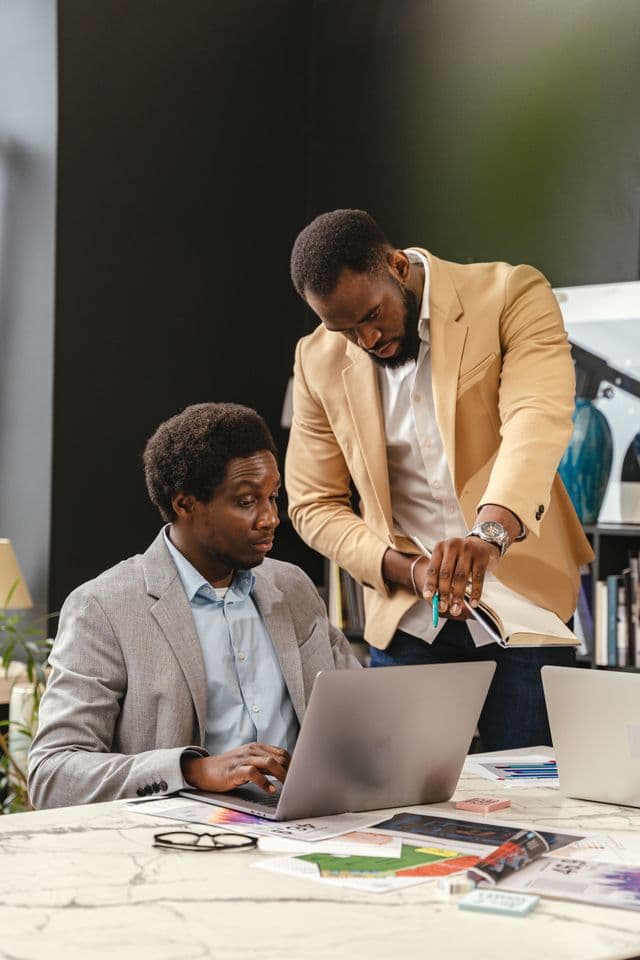 Two business professionals standing with arms crossed